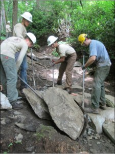 Crew moving stone steps on Chimney Tops Trail