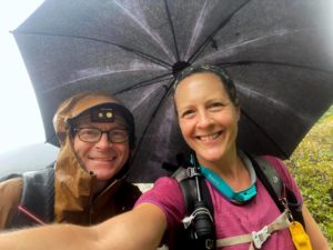 Chris Ford and Nancy East with hiking umbrella