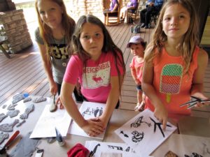 Children use foam blocks to create prints of animals and animal footprints at GSMNP