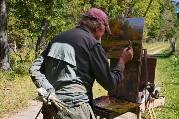 artist painting in Cades Cove during Plein Air in the Smokies 2022