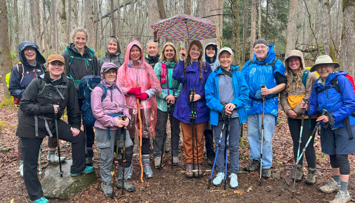 Fifteen hikers gather in the rain at Porters Creek Trail.