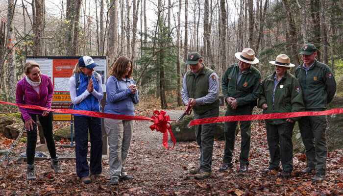 Trails Forever Crew supervisor Josh Shapiro cuts the ribbon