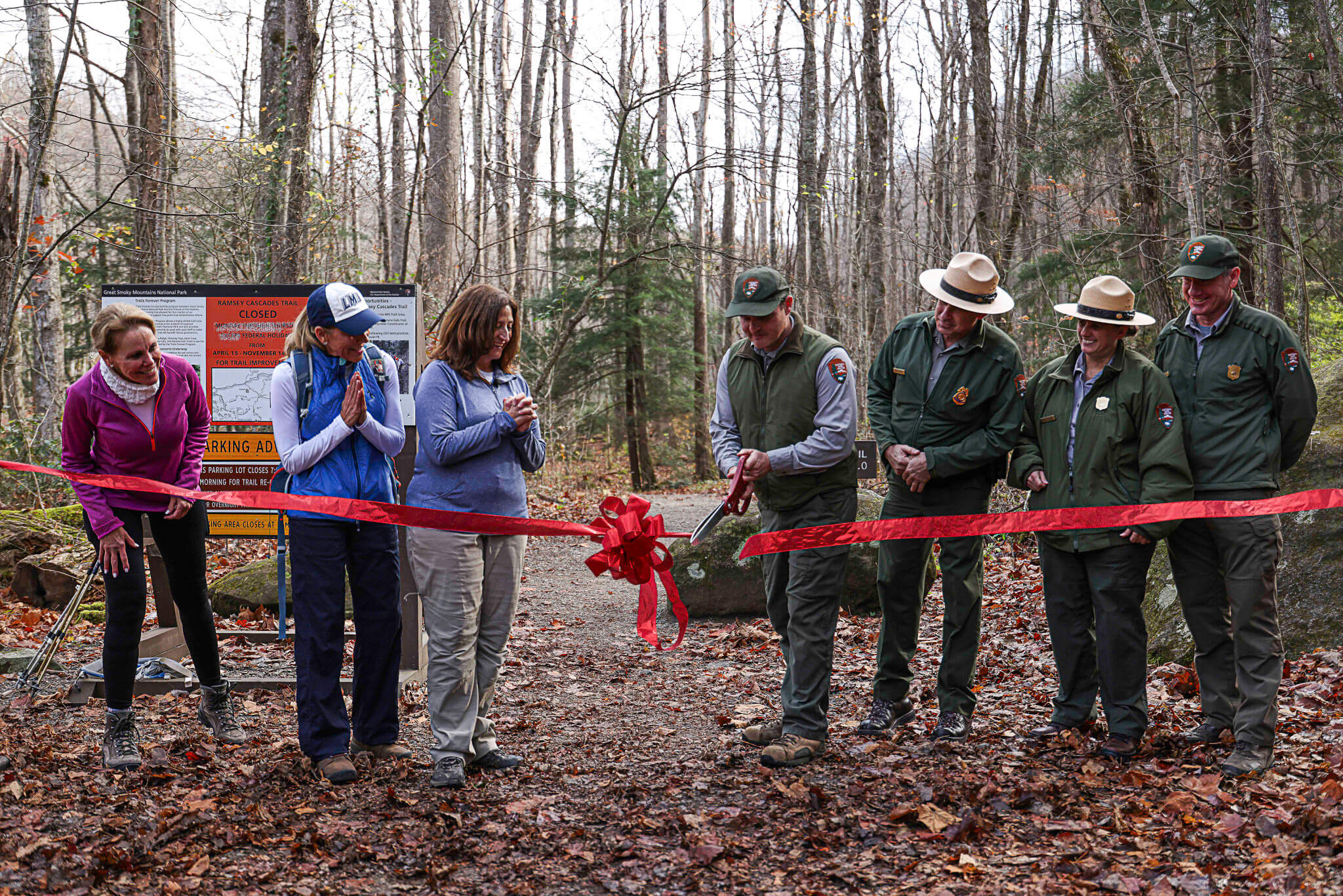 Trails Forever Crew supervisor Josh Shapiro cuts the ribbon