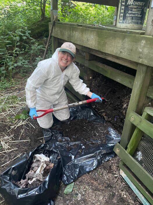 Collin Chambers cleans privy at Tricorner Knob Shelter
