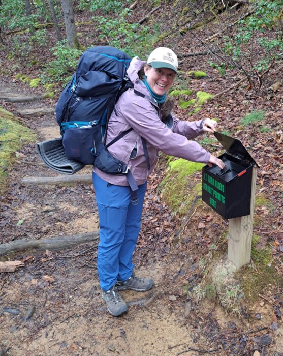 Ridgerunner Collin Chambers checking backcountry permits